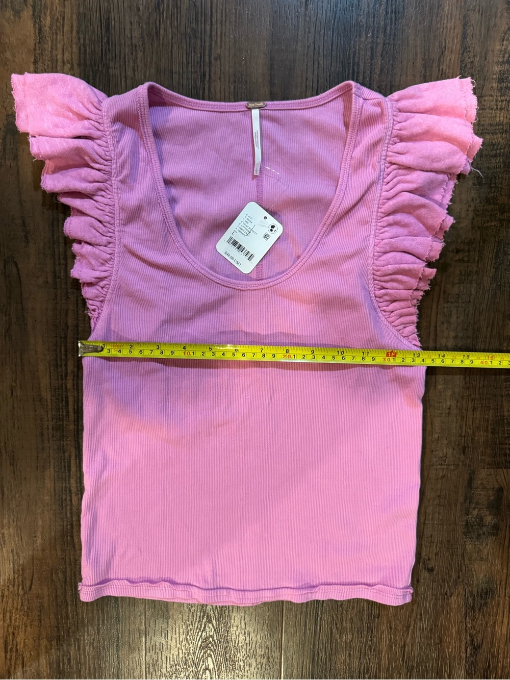 NWT Free people Jonny Tank.
Pink Lilac bouquet Ruffle Sleeve Ribbed Tank Size L